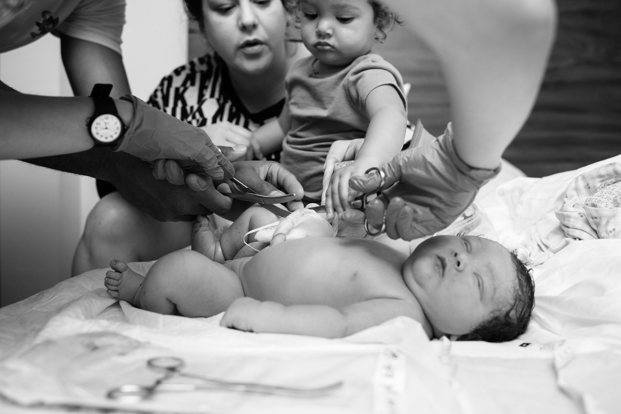 Mother, Child and Midwife tending New Born